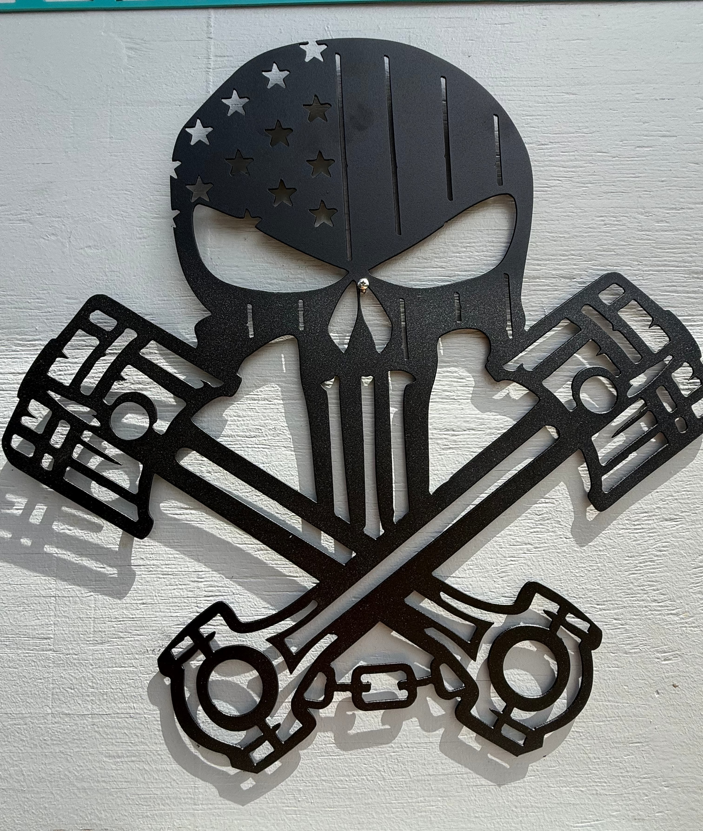 Skull with pistons Sign